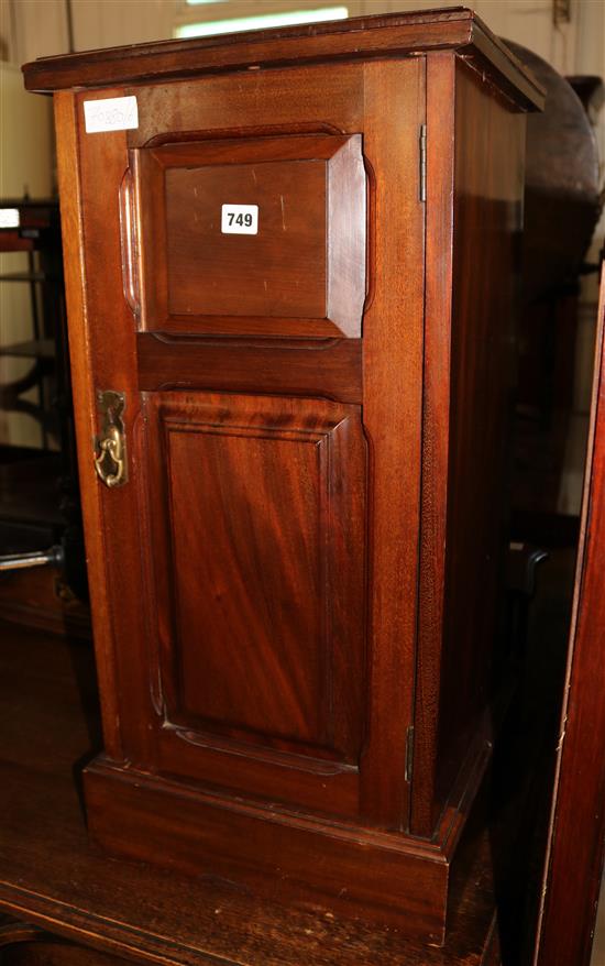 A mahogany bedside cupboard